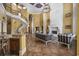 Spacious great room features a grand fireplace, spiral staircase, and ample seating at 1549 Serena Dr., Myrtle Beach, SC 29579