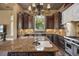 Gourmet kitchen boasts a large island, custom cabinets, and stainless steel appliances at 1549 Serena Dr., Myrtle Beach, SC 29579