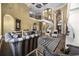 Bright living room boasts soaring ceilings, elegant staircase, and stylish striped furniture at 1549 Serena Dr., Myrtle Beach, SC 29579