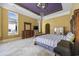 Spacious main bedroom boasts elegant tray ceiling, chandelier, and well-lit dressing area at 1549 Serena Dr., Myrtle Beach, SC 29579