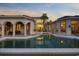 The backyard features a large swimming pool, an outdoor kitchen and dining area, as well as many access points to the house at 1549 Serena Dr., Myrtle Beach, SC 29579