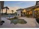 The backyard features a swimming pool, a spa, an outdoor dining area, and golf course views at 1549 Serena Dr., Myrtle Beach, SC 29579