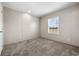 Spacious bedroom featuring carpeted floors and a window with blinds at 215 Eva Dr., Loris, SC 29569