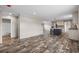 Open concept dining area with kitchen view and wood-look floors at 215 Eva Dr., Loris, SC 29569