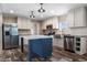 Open concept kitchen with island and stainless steel appliances at 215 Eva Dr., Loris, SC 29569