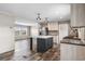 Open concept kitchen with island and stainless steel appliances at 215 Eva Dr., Loris, SC 29569