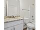 Bathroom features a single sink vanity with gray granite countertop and shower and tub combo at 7913 E Highway 19, Loris, SC 29569