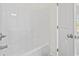 Bathroom features a tub and shower combo with white walls at 7913 E Highway 19, Loris, SC 29569