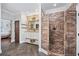 Large walk-in shower with brick tile and a modern vanity at 130 Hagar Brown Rd., Murrells Inlet, SC 29576