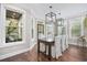 Bright dining room with a farmhouse table and access to a deck at 130 Hagar Brown Rd., Murrells Inlet, SC 29576