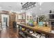 Rustic kitchen island with a farmhouse sink and pot rack at 130 Hagar Brown Rd., Murrells Inlet, SC 29576