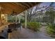 Outdoor patio with dining set and grill, overlooking pool at 130 Hagar Brown Rd., Murrells Inlet, SC 29576