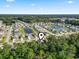 Aerial view of the neighborhood featuring homes surrounding community ponds and lush landscapes at 149 Harmony Ln., Myrtle Beach, SC 29588