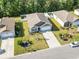 Aerial view of a home with manicured lawn, landscaping, and a driveway, showcasing the property's layout at 149 Harmony Ln., Myrtle Beach, SC 29588