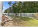 Fenced backyard features a patio, mulch beds, and a grassy area, great for outdoor activities at 149 Harmony Ln., Myrtle Beach, SC 29588