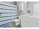 Bathroom featuring shower with striped curtain and white cabinet and vanity at 149 Harmony Ln., Myrtle Beach, SC 29588