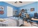 Blue bedroom with a large window and display shelves filled with unique decorative items at 149 Harmony Ln., Myrtle Beach, SC 29588