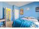 Bright bedroom with blue walls, plush carpet and doorways to adjacent rooms at 149 Harmony Ln., Myrtle Beach, SC 29588