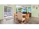 Dining area with access to living room and patio with outdoor seating area at 149 Harmony Ln., Myrtle Beach, SC 29588