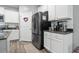 Bright kitchen features stainless steel refrigerator and appliances plus granite countertops at 149 Harmony Ln., Myrtle Beach, SC 29588