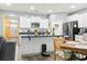 Bright kitchen with stainless steel appliances, white cabinets, and an island at 149 Harmony Ln., Myrtle Beach, SC 29588