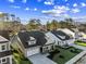 An aerial view shows this home with an attached two-car garage, manicured lawn and landscaping at 5032 Cambria Ct., Little River, SC 29566