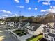 Aerial view of a community with similar homes, well-manicured lawns, and tree lined streets at 5032 Cambria Ct., Little River, SC 29566