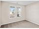 Bright, carpeted bedroom featuring two windows providing ample natural light at 5032 Cambria Ct., Little River, SC 29566