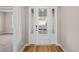 Welcoming entryway with a wood floor and a glass paneled front door at 5032 Cambria Ct., Little River, SC 29566