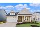Charming single-Gathering home with a two-car garage and a beautifully landscaped front yard at 5032 Cambria Ct., Little River, SC 29566