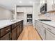 Open kitchen featuring stainless steel appliances, a mosaic tile backsplash, and a kitchen island with a sink at 5032 Cambria Ct., Little River, SC 29566