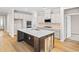 Modern kitchen with an island, stainless appliances, a mosaic backsplash, and plenty of storage at 5032 Cambria Ct., Little River, SC 29566
