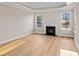 Bright, spacious living room features luxury vinyl flooring, a tray ceiling and a modern fireplace at 5032 Cambria Ct., Little River, SC 29566