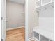 Bright mud room features hooks and a bench with storage underneath as well as a closet at 5032 Cambria Ct., Little River, SC 29566