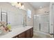 Bright bathroom with a large vanity, a shower and glass doors at 621 Elgin Ct., Myrtle Beach, SC 29579