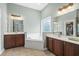Bathroom with dual vanities, soaking tub, and stylish fixtures creating a spa-like retreat at 621 Elgin Ct., Myrtle Beach, SC 29579