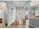 Open concept foyer with hardwood floors, elegant lighting, and a view of the dining area at 621 Elgin Ct., Myrtle Beach, SC 29579
