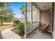 Inviting front porch view features classic columns and outdoor seating at 621 Elgin Ct., Myrtle Beach, SC 29579