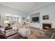 Comfortable living room featuring a fireplace and built-in shelving at 621 Elgin Ct., Myrtle Beach, SC 29579