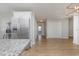 Kitchen with stainless steel refrigerator and hardwood floors at 9557 Sullivan Dr., Murrells Inlet, SC 29576