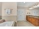 The primary bathroom features a double vanity and a soaking tub at 1002 Summers Pl., North Myrtle Beach, SC 29582