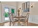 Bright dining area with a table set for a meal and access to the outdoor patio at 1002 Summers Pl., North Myrtle Beach, SC 29582