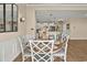 Cozy dining area with stylish chairs, a decorative mirror, and a view into the kitchen at 1002 Summers Pl., North Myrtle Beach, SC 29582