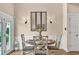 Elegant dining area with a round table, stylish chairs, and modern lighting at 1002 Summers Pl., North Myrtle Beach, SC 29582