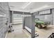 Organized garage featuring an automobile, slatwall panels and overhead storage cabinets at 1002 Summers Pl., North Myrtle Beach, SC 29582