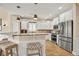 Bright eat-in kitchen features stainless appliances, granite countertops and a breakfast bar with seating at 1002 Summers Pl., North Myrtle Beach, SC 29582