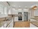 This bright kitchen features stainless appliances, granite countertops and white cabinetry at 1002 Summers Pl., North Myrtle Beach, SC 29582
