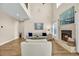 Spacious living room with a fireplace, high ceilings, and a view of the second-floor balcony at 1002 Summers Pl., North Myrtle Beach, SC 29582