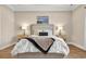 Inviting bedroom featuring tray ceilings, hardwood floors and two bedside tables at 1002 Summers Pl., North Myrtle Beach, SC 29582
