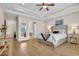 This main bedroom features hardwood floors, tray ceilings and access to the ensuite bath at 1002 Summers Pl., North Myrtle Beach, SC 29582